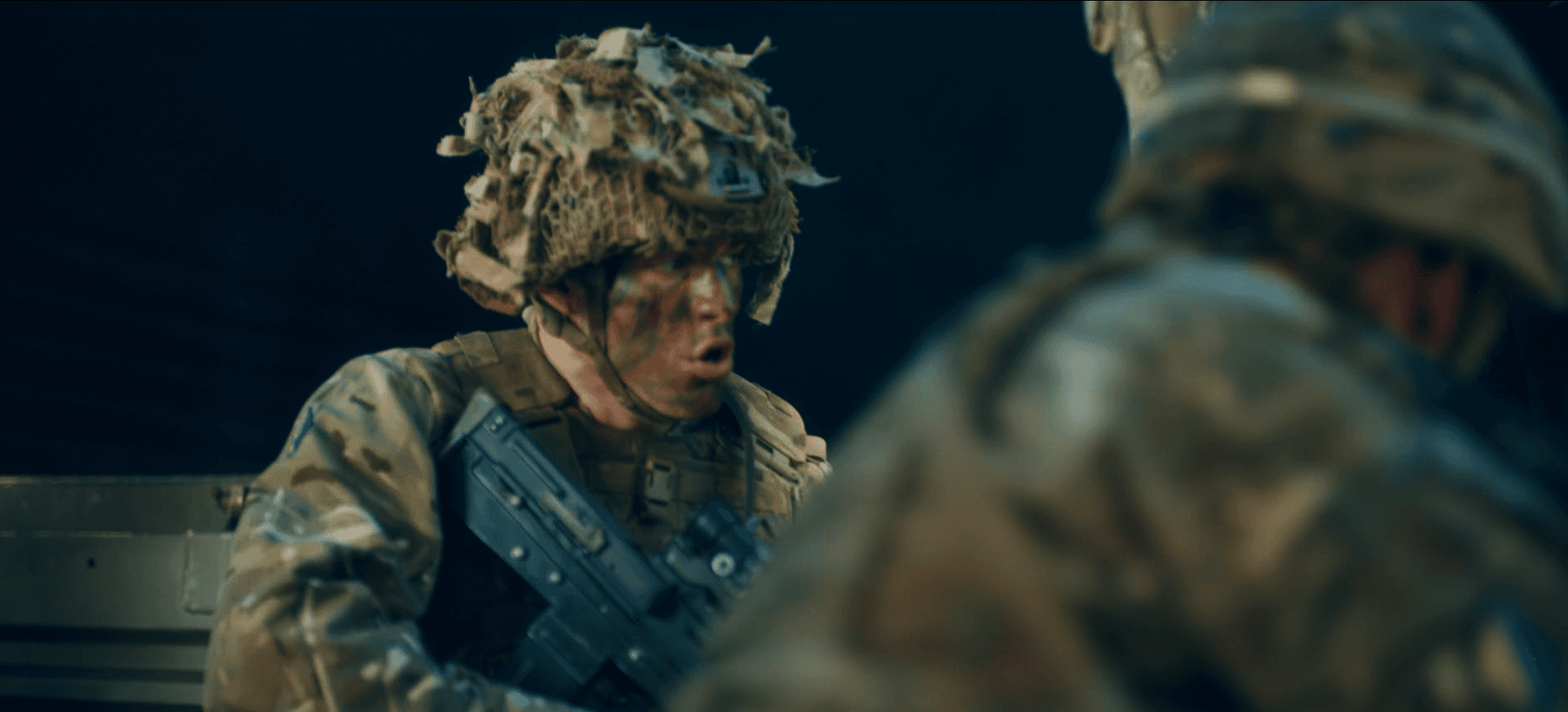 Tristan Alexander in full modern military combat gear with helmet and rifle